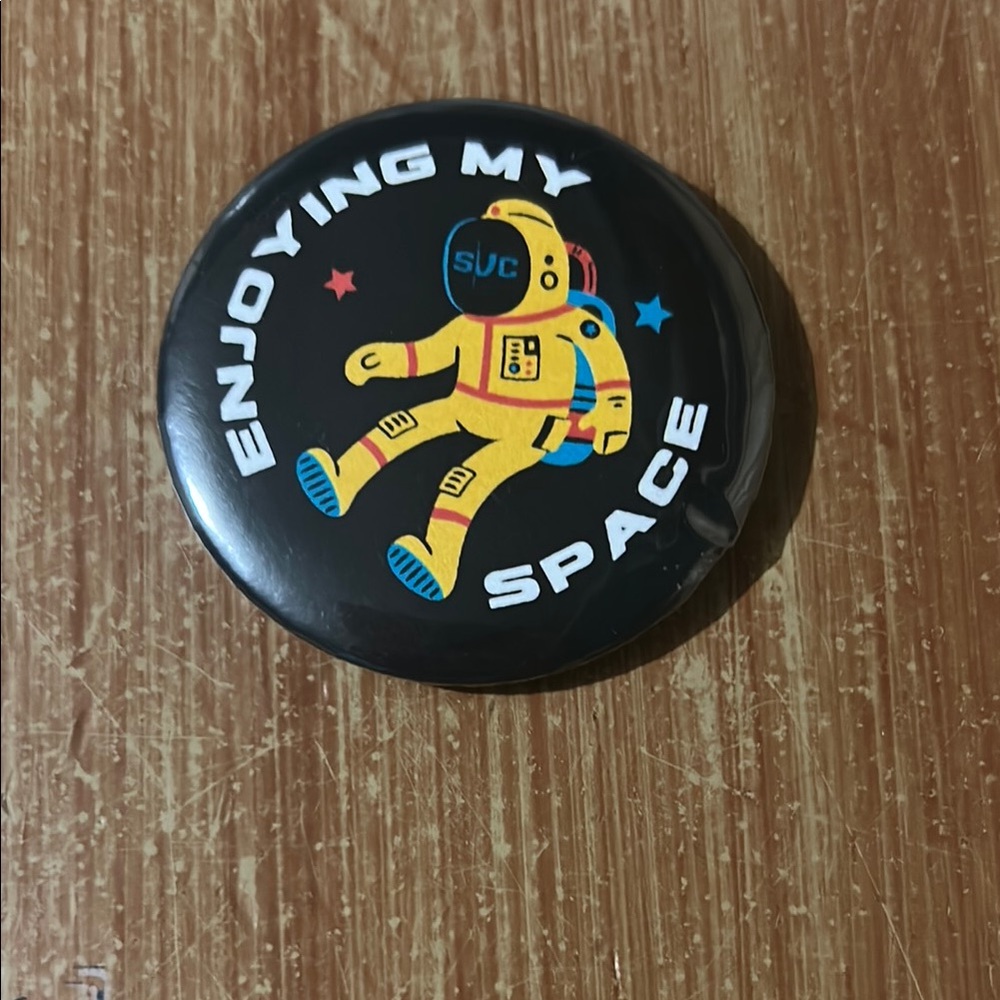 Black Button with Astronaut Design